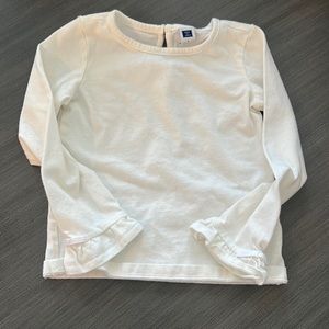 Plain white long sleeve with bow details on sleeves.